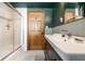 Bathroom featuring a shower with glass door and classic sink at 933 Tecumseh St, Indianapolis, IN 46201