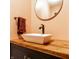Modern bathroom with a square vessel sink and wooden countertop at 933 Tecumseh St, Indianapolis, IN 46201