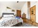 Comfortable bedroom with a cozy bed, wooden accents, and a decorative Michigan State banner at 933 Tecumseh St, Indianapolis, IN 46201