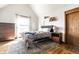 Bright bedroom with a large window, stylish furniture, and a charming rug at 933 Tecumseh St, Indianapolis, IN 46201
