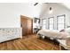 Spacious bedroom with hardwood floors, a desk, and ample storage at 933 Tecumseh St, Indianapolis, IN 46201