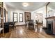 Dining area with hardwood floors, and a decorative fireplace at 933 Tecumseh St, Indianapolis, IN 46201