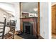Detailed fireplace with unique tiling and vintage mantle at 933 Tecumseh St, Indianapolis, IN 46201