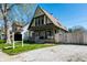 Charming two-story home featuring a steeply pitched roof and inviting front porch at 933 Tecumseh St, Indianapolis, IN 46201