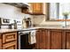 Charming kitchen featuring updated appliances and granite countertops at 933 Tecumseh St, Indianapolis, IN 46201