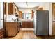 Well-lit kitchen with granite counters, stainless steel appliances, and hardwood floors at 933 Tecumseh St, Indianapolis, IN 46201
