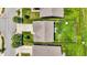 Aerial view of a home with a fenced backyard, driveway, landscaping, and nearby street at 950 Redwood Dr, Franklin, IN 46131