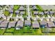 Aerial view of the home with a lush green lawn, landscaping, and neighborhood with tree-lined streets at 950 Redwood Dr, Franklin, IN 46131