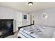 Cozy bedroom featuring a plush bed, neutral tones, and ample natural light at 950 Redwood Dr, Franklin, IN 46131