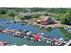 A vibrant aerial view displays the bustling waterfront and marina with beautiful lake views at 10235 Normandy Way, Fishers, IN 46040