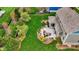 Stunning aerial view of the backyard with patio, lush lawn, landscaping, and home exterior at 10235 Normandy Way, Fishers, IN 46040