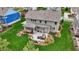 Aerial perspective of the home's backyard featuring a patio with furniture, landscaping, and well-kept lawn at 10235 Normandy Way, Fishers, IN 46040