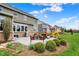 Backyard with patio seating, lush landscaping, and a well-maintained lawn at 10235 Normandy Way, Fishers, IN 46040