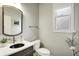Stylish bathroom featuring modern sink, geometric wallpaper, and natural light from the window at 10235 Normandy Way, Fishers, IN 46040