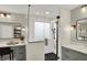 Modern bathroom featuring double vanities, stylish mirrors, and a glass-enclosed walk-in shower at 10235 Normandy Way, Fishers, IN 46040