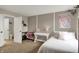 Inviting bedroom featuring neutral walls, a double bed, a window with a view, a desk, and a chair at 10235 Normandy Way, Fishers, IN 46040