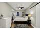Bedroom with natural light, a ceiling fan, and modern decor with a barn door feature at 10235 Normandy Way, Fishers, IN 46040