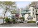 A beautiful building near the lake features stone and teal accents adding charm to the landscape at 10235 Normandy Way, Fishers, IN 46040