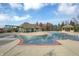 Inviting community pool with lounge chairs, shaded pergola, and ample space for recreation at 10235 Normandy Way, Fishers, IN 46040