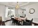 Stylish dining room with unique lighting and ample natural light at 10235 Normandy Way, Fishers, IN 46040