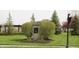 Landscaped community entrance with signage welcomes residents and visitors with style at 10235 Normandy Way, Fishers, IN 46040
