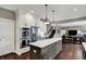 Modern kitchen featuring white cabinets, stainless steel appliances, and an island with seating at 10235 Normandy Way, Fishers, IN 46040