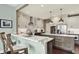 Bright and airy kitchen with white cabinets, stainless steel appliances, and quartz countertops at 10235 Normandy Way, Fishers, IN 46040