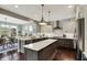 Beautiful kitchen featuring stainless steel appliances, a center island and an open concept to the dining room at 10235 Normandy Way, Fishers, IN 46040