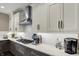 Close up of the kitchen featuring quartz counters, gas range and subway tile backsplash at 10235 Normandy Way, Fishers, IN 46040