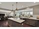 Open kitchen featuring a spacious island, stainless steel appliances, and hardwood floors at 10235 Normandy Way, Fishers, IN 46040