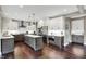 Modern kitchen with stainless steel appliances, an island, and elegant cabinetry at 10235 Normandy Way, Fishers, IN 46040