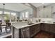 Kitchen area with stainless steel appliances, quartz counters and an open concept to the dining room at 10235 Normandy Way, Fishers, IN 46040