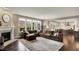 Expansive living area with a plush sectional sofa and a view into the modern kitchen at 10235 Normandy Way, Fishers, IN 46040