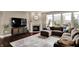 Open-concept living room with lots of natural light and modern furnishings at 10235 Normandy Way, Fishers, IN 46040