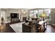 Inviting living room featuring a corner fireplace and an expansive view of the outdoors at 10235 Normandy Way, Fishers, IN 46040