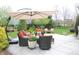 Relaxing patio with outdoor seating, umbrella, and elegant decor, ideal for entertaining or enjoying peaceful moments at 10235 Normandy Way, Fishers, IN 46040