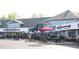 A charming local shopping center offers a variety of dining options with outdoor seating at 10235 Normandy Way, Fishers, IN 46040