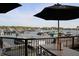 Outdoor dining with a view showcases waterfront dining with boats in the background at 10235 Normandy Way, Fishers, IN 46040