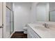 Bathroom featuring a tiled shower with glass doors, toilet, and a large vanity at 1200 Shadow Ridge Rd, Carmel, IN 46280
