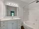 Bright bathroom featuring a vanity with white cabinets and a tub/shower combo at 1200 Shadow Ridge Rd, Carmel, IN 46280