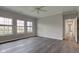 Bedroom featuring wood-look floors, natural light, and neutral paint at 1200 Shadow Ridge Rd, Carmel, IN 46280