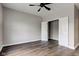 Bedroom featuring dark wood-look floors and a closet with bi-fold doors at 1200 Shadow Ridge Rd, Carmel, IN 46280