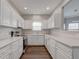 Bright kitchen with white cabinetry, stainless appliances, and hardwood flooring at 1200 Shadow Ridge Rd, Carmel, IN 46280