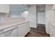 Kitchen featuring white cabinets, dishwasher and a hardwood floor at 1200 Shadow Ridge Rd, Carmel, IN 46280