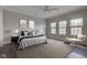 Bright main bedroom with plush carpet, ample natural light, and modern furnishings, creating a serene retreat at 1200 Shadow Ridge Rd, Carmel, IN 46280