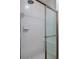 Tiled shower with sliding glass doors and updated shower head at 1200 Shadow Ridge Rd, Carmel, IN 46280