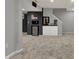 Finished basement space with carpet and wet bar offers an ideal entertainment area at 12027 Sellerton Dr, Fishers, IN 46037
