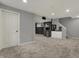 Spacious carpeted basement space features a wet bar and access to other areas at 12027 Sellerton Dr, Fishers, IN 46037