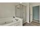 This bathroom has a large soaking tub with jets and a glass enclosed shower at 12027 Sellerton Dr, Fishers, IN 46037