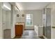 Primary bathroom featuring double sinks, a soaking tub, and a separate shower with glass doors at 12027 Sellerton Dr, Fishers, IN 46037